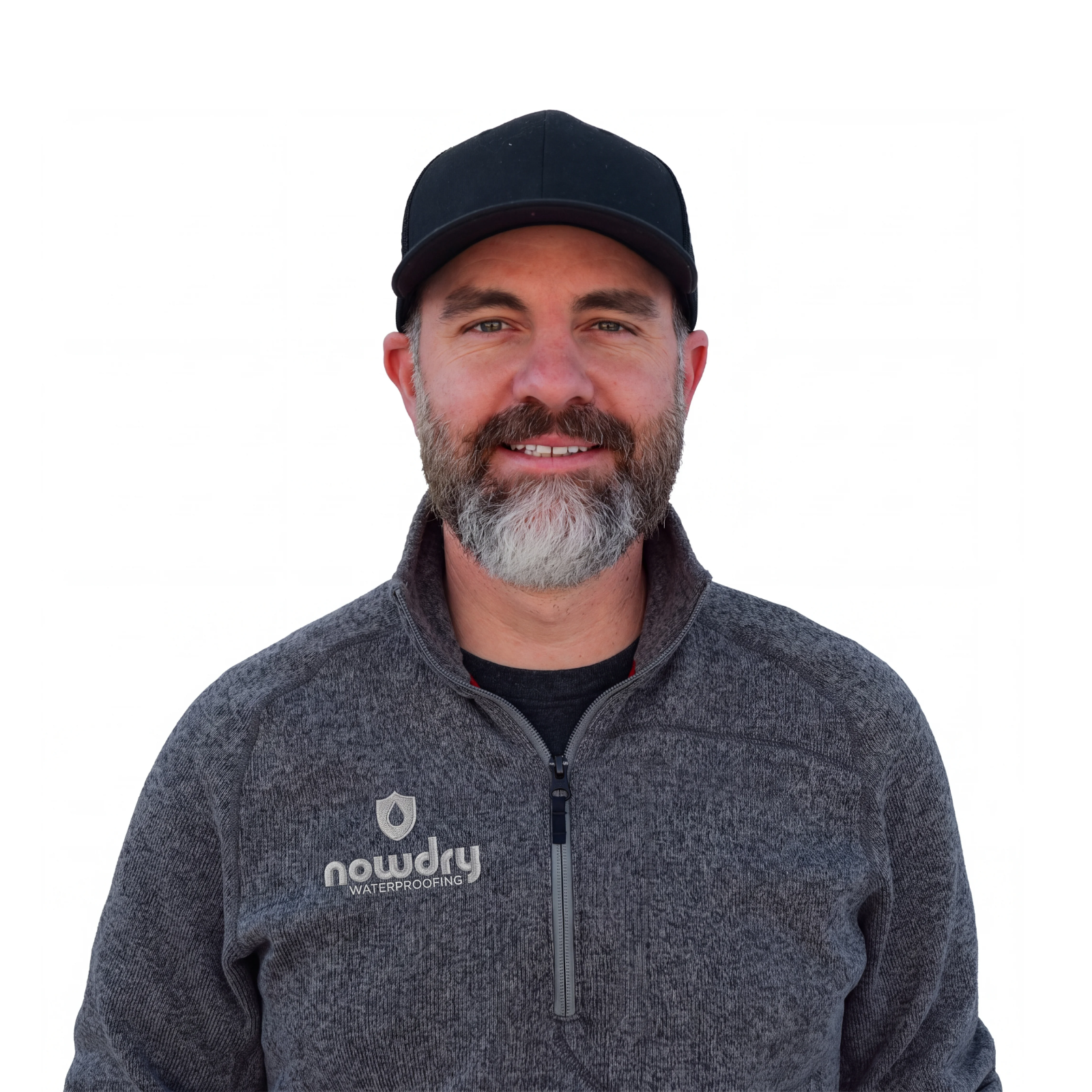 Mike Rutherford, smiling in a black NowDry cap and gray zip-up fleece against a white background
